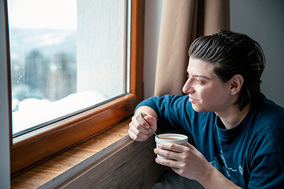 Young Man at Window Eating